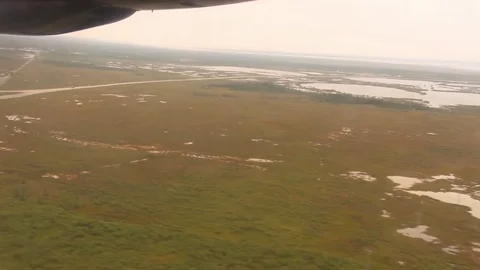 Propeller plane landing in open field Stock Footage 82020500