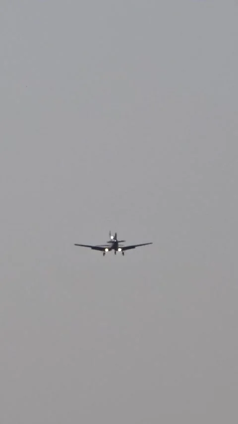 Propeller powered single engine airplanes flying for their final approach into Video stock 296764685