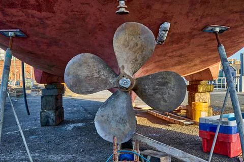 The propeller of a ship in dry dock Stock Photos