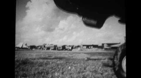 Propeller spinning and military base at distant Stock Footage