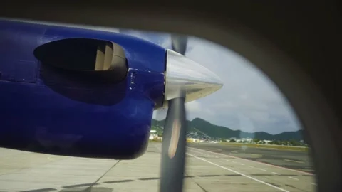 Propeller spinning from inside small plane on airport runway Stock Footage 168775318