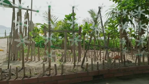 Propellers cut out of plastic bottles rotate in the wind Video stock 334856216