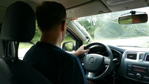 Proper car driving. The driver steers and unfolds the car Stock Footage 93783727