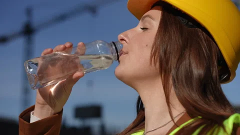 Proper Hydration for Construction Workers on the Job Site is Crucial for Safety Stock Footage 311858026