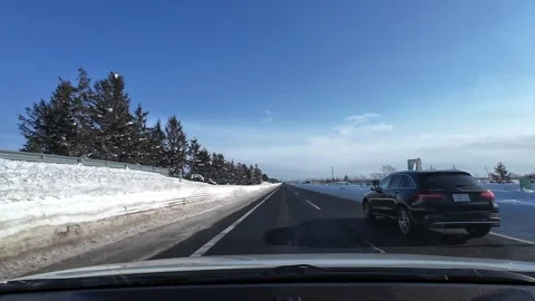 Proper lane discipline overtaking and returning left snowy expressway Japan Stock Footage 333229734