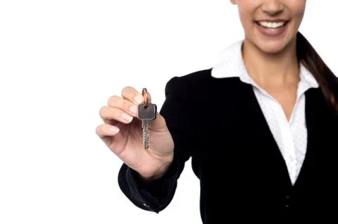 Property agent showing key. Stock Photos