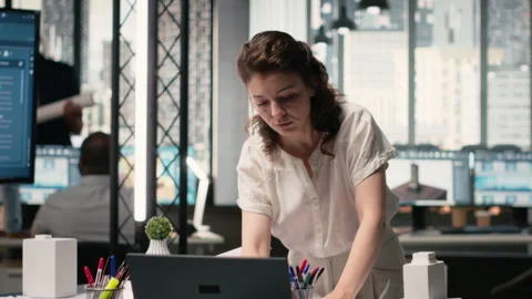 Property developer finalizing plans for land acquisition in modern office space 動画素材 316643014