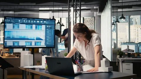 Property developer finalizing plans for land acquisition in modern office space Stock Photos
