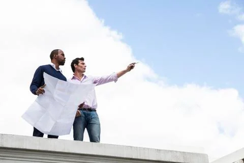 Property developer sharing vision with colleague 스톡 사진