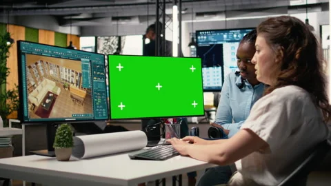 Property developer working with architectural floor plans and mockup display Stock Footage 316795867