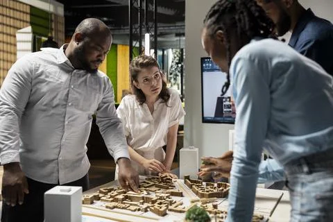 Property developers discuss the challenges of city planning and land acquisition Stock Photos