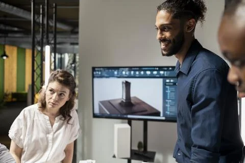Property development team evaluating 3D models structural layout Stock Photos