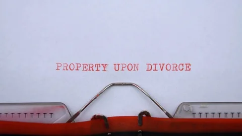 Property upon divorce - phrase printed on an old typewriter in red letters Stock Footage 129535898