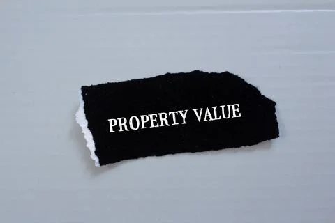Property value lettering on black torn paper with gray background Stock Illustration