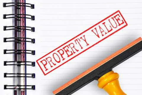 Property value rubber stamp on the note book 写真素材