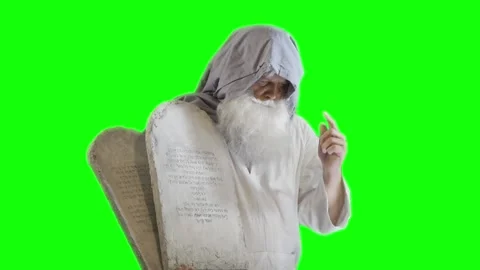 Prophet Moses holds the tablets with the ten commandments on a green Stock Footage 265250552