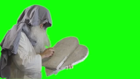 Prophet Moses holds the tablets with the ten commandments on a green Video stock 265250788