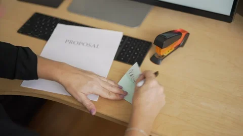 Proposal with Urgent Sticky Note Stock Footage 114132366