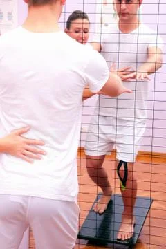 Proprioceptive exercises for legs with tilting pad Stock Photos