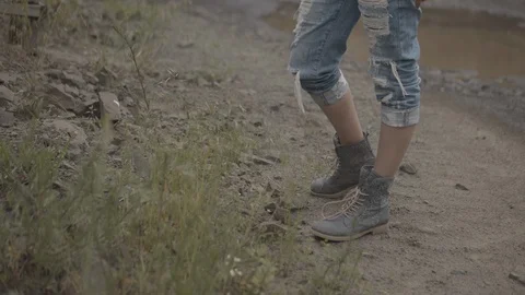 ProRes 4:2:2 log, slow motion footage. Young woman walking in basalt career. Stock Footage 109334976