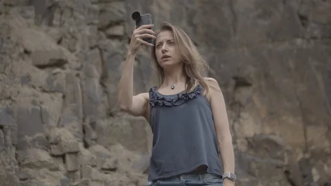 ProRes 4:2:2 log, slow motion footage. Young woman walking in basalt career. Video stock 109493455