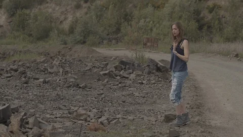 ProRes 4:2:2 log, slow motion footage. Young woman walking in basalt career. Video stock 109509432