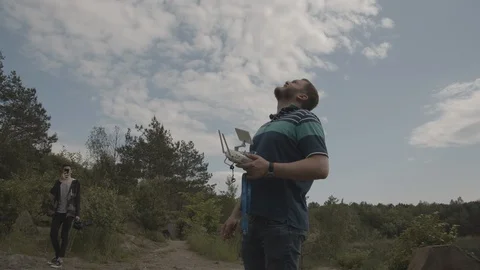 ProRes 4:2:2 log, slow motion footage. Man operating drone Stock Footage 109582041
