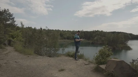 ProRes 4:2:2 log, slow motion footage. Man operating drone Stock Footage 109584623
