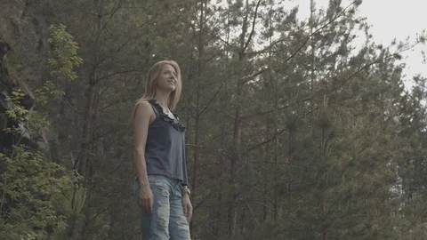 ProRes 4:2:2 log, slow motion footage. Young woman walking in basalt career. Vídeo Stock 109605439