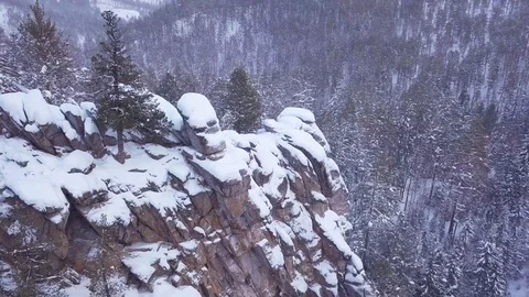ProRes. Winter forest and rocks from aerial view. Landscape. Stock Footage 84192945