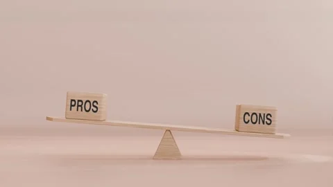 PROS AND CONS BALANCING ON SEESAW Vídeo Stock 294674880