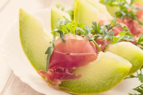 Prosciutto and melon Stock Photos
