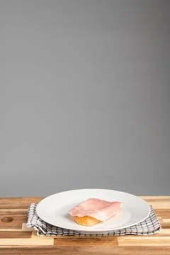 Prosciutto on Bread on White Plate Stock Photos
