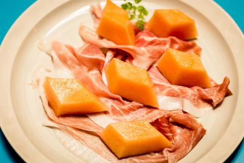 PROSCIUTTO DI PARMA E MELONE Parma ham, rock melon Stock Photos