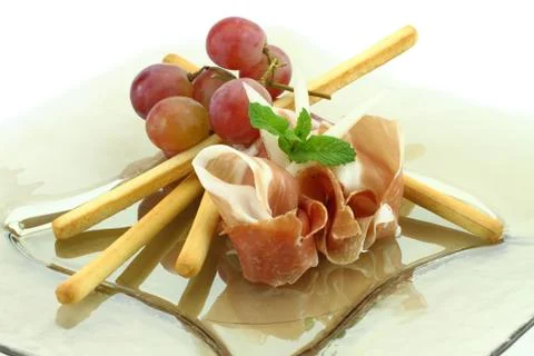 Prosciutto with grissini appetizer Stock Photos