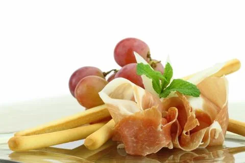 Prosciutto with grissini appetizer Stock Photos