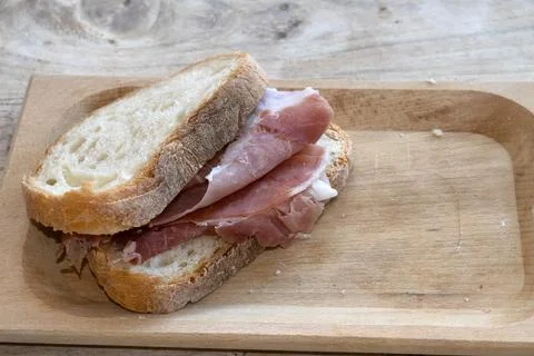Prosciutto Sandwich on Rustic Bread Slices 库存照片