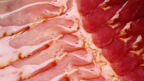 Prosciutto serrano ham cured meat pork dry crudo looping texture pattern closeup Video stock 99012558