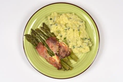 Prosciutto Wrapped Asparagus with Mashed Potatoes Stock Photos