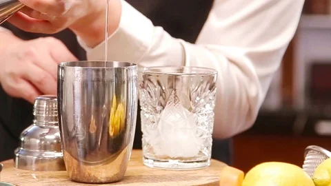 Prose of pouring liquid from the jigger cup into a glass Stock Footage 121734159