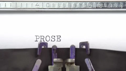 Prose word closeup being typing and centered on a sheet of paper on old vintage Stock Footage 230701173