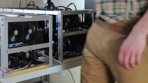 Prospector works as a pick on the mining farm Video stock 87044899