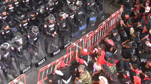 PROSTESTERS CONFRONT RIOT POLICE Demonstration Non Violent Resist Bangkok 2010 Stock Footage