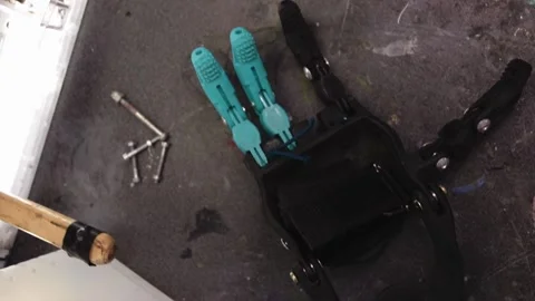 Prosthesis for hands. Assembly of a prosthetic hand in the garage Stock Footage 171884495