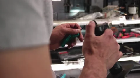 Prosthesis for hands. Assembly of a prosthetic hand in the garage Stock Footage 171884702