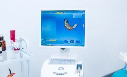 Prosthesis modeling process using CAD CAM dental computer-aided machine in a Stock Photos