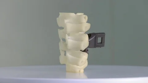 Prosthesis for vertebrae printed with 3D technology. Medical prosthesis. Stock Footage 81852970