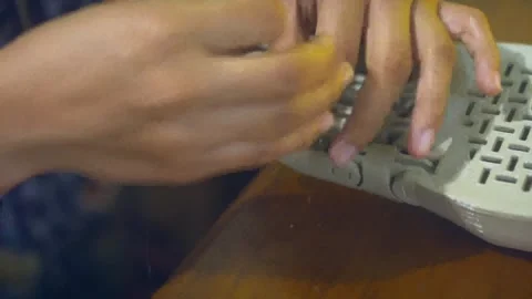 Prosthetic hand created by 3d printer with final adjustments being made Stock Footage 263403028