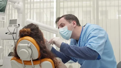 Prosthodontist Is Treating Young Woman Stock Footage 145627336