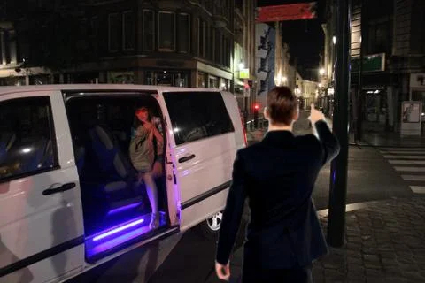 Prostitute talking with client on the street Stock Photos